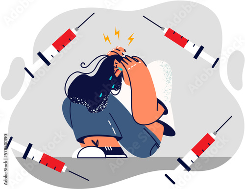 Woman drug addict crying sitting on floor needs rehabilitation after heroin addiction