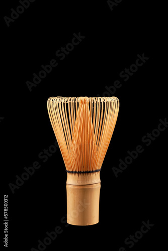 Chasen or Bamboo tea whisk on black background, close-up. Accessory for whipping Matcha tea