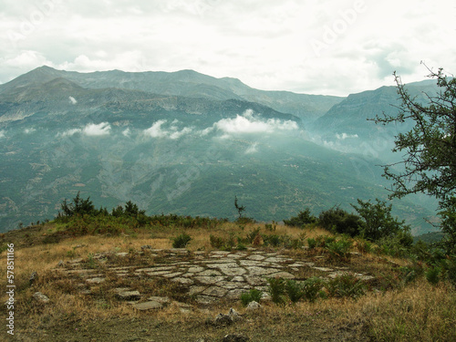 Scenic view of threshing floor with a mountain in the background