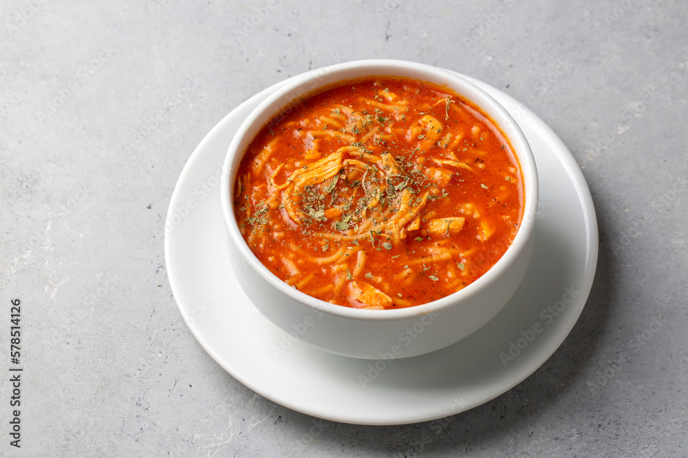 Chicken noodle soup with tomato. Turkish name; Domatesli tavuklu sehriye corbasi Chicken noodle soup with tomato. Turkish name; Domatesli tavuklu sehriye corbasi