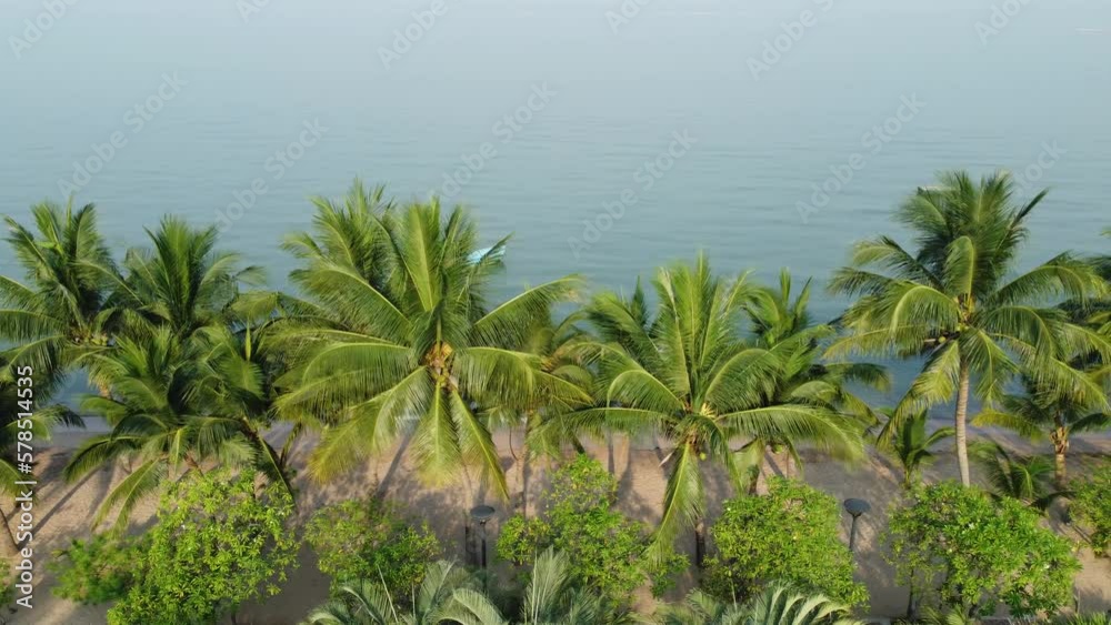 Beatifull beach, crystal-clear waters, and swaying coconut trees create a breathtaking scenery at Thailand's. 4K Footage Aerial view from a drone Travel and leisure concepts in Thailand. Beatifull beach, crystal-clear waters, and swaying coconut trees create a breathtaking scenery at Thailand's. 4K Footage Aerial view from a drone Travel and leisure concepts in Thailand.