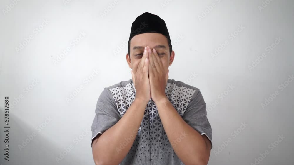 Indonesian Asian muslim man successful gesture wears black hat peci or songkok