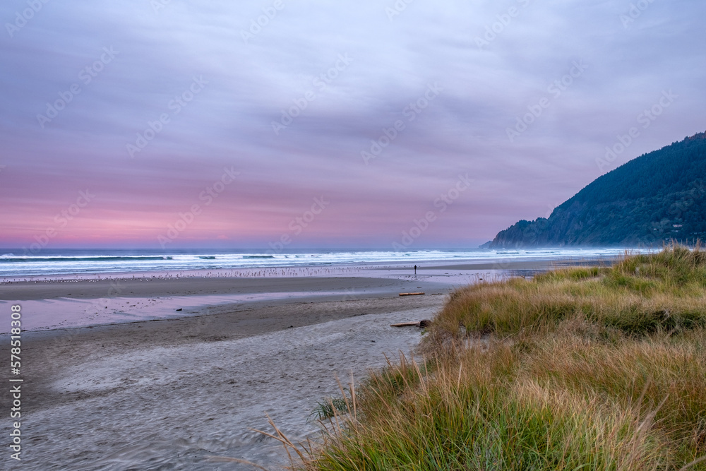 Very early sunrise, with intense colors on the beach of Manzanita, Oregon, USA Very early sunrise, with intense colors on the beach of Manzanita, Oregon, USA