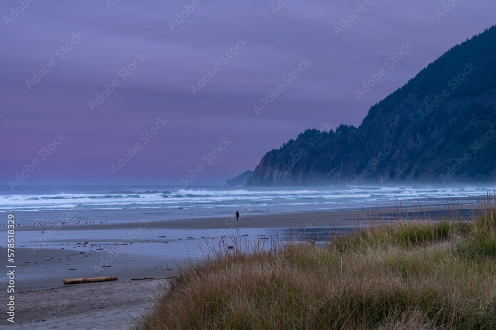 Very early sunrise, with intense colors on the beach of Manzanita, Oregon, USA