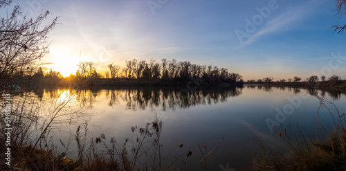 Panoramic view of river bend at sunrise 