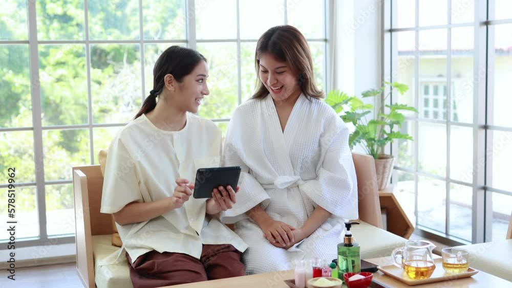 Asian woman paying for beauty spa services, smart phone Asian woman paying for beauty spa services, smart phone
