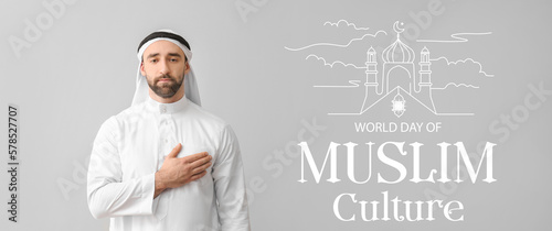 Handsome Arabian man on grey background. World Day of Muslim Culture photo