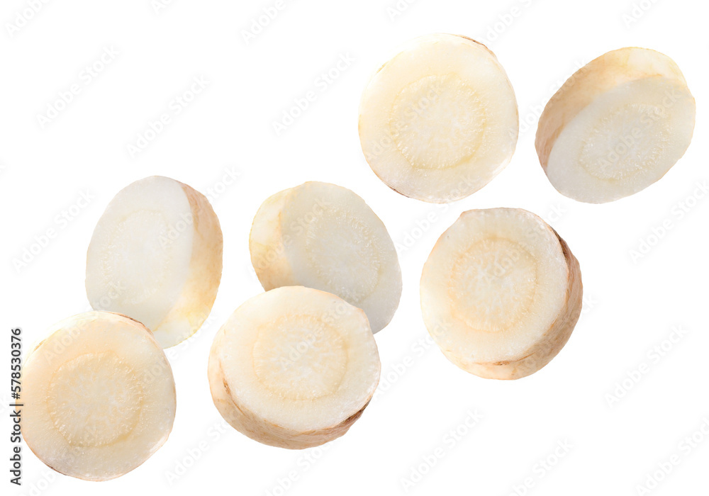 Slices of fresh parsley root falling on white background