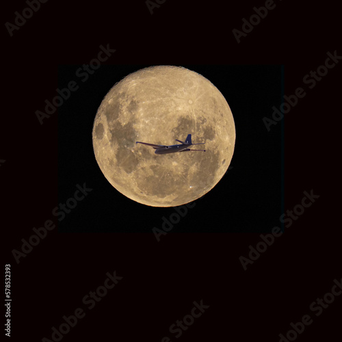 Air Force plane against full moon
