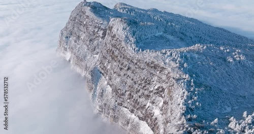 snowy mountain cliff above the clouds aerial view of Emei mountain in the winter  photo