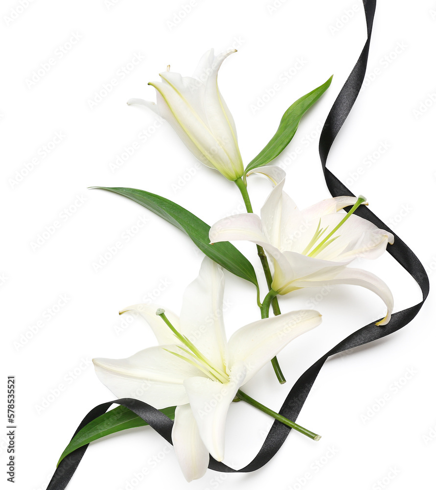 Composition with beautiful lily flowers and black funeral ribbon on white background