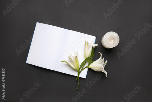 Blank open book, lily flowe...