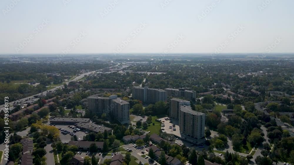 Drone orbiting around an apartment buildings on a hazy day in London. Drone orbiting around an apartment buildings on a hazy day in London.