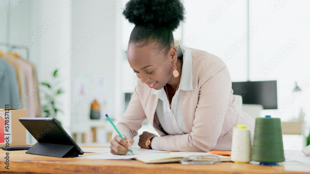 Black woman, tablet and writing in business ecommerce of fashion designer in digital marketing at office. Happy African female retail clothing owner working on touchscreen for schedule planning Black woman, tablet and writing in business ecommerce of fashion designer in digital marketing at office. Happy African female retail clothing owner working on touchscreen for schedule planning