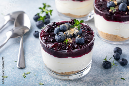 Fototapete Blueberry cheesecake in a jar with graham cracker base