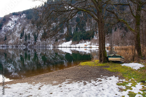 The snowy December landscape at Afritzer See Lake in Carinthia, Austria. Located in the Gegendtal Valley, it is in the Nock Mountains of the Gurktal Alps photo