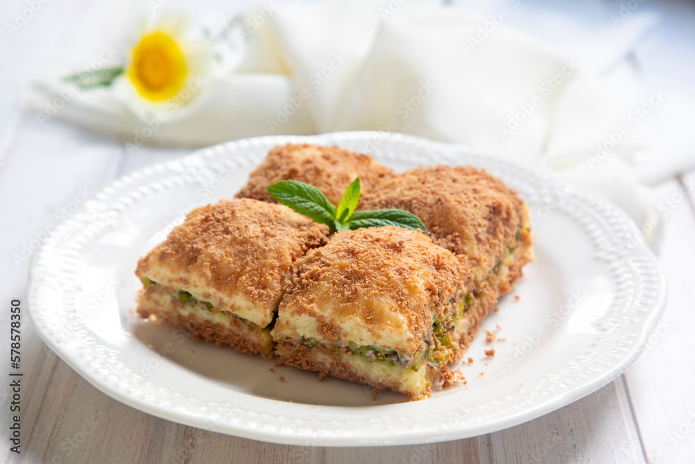 Traditional turkish new dessert cold milky baklava with pistachio (Turkish name; soguk baklava)