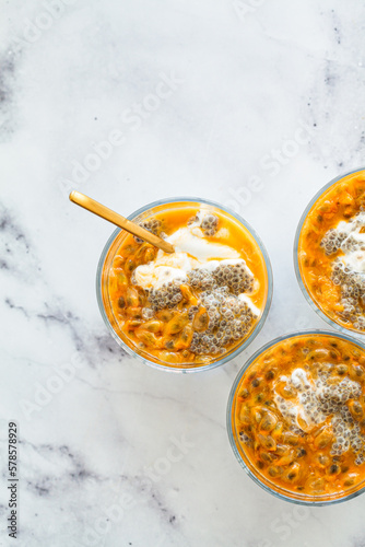 Chia pudding with passion fruit and coconut yogurt in glass. Healthy vegan recipe.