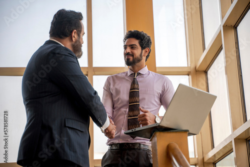 Canvas Print Indian businessman meet with new joined manager or employee
