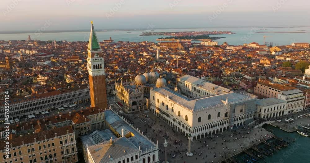 People At Piazza San Marco With The Famous St Mark's Campanile In Venice, Italy. Aerial Drone Shot People At Piazza San Marco With The Famous St Mark's Campanile In Venice, Italy. Aerial Drone Shot