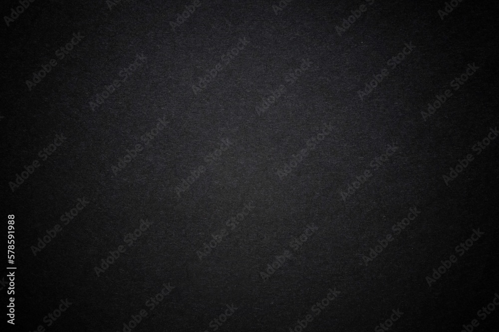 Black dark background with light copyspace in middle. Toned grunge retro vintage wallpaper with cardboard texture surface. Mockup design for dark arts. Blackout Tuesday concept. protest.