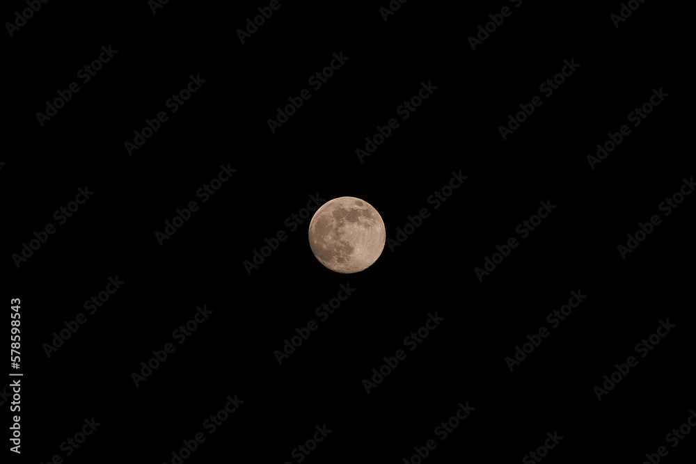 Super full moon with dark background. A full moon or a new moon that approximately coincides with the closest distance that the Moon reaches to Earth in its orbit. Super full moon with dark background. A full moon or a new moon that approximately coincides with the closest distance that the Moon reaches to Earth in its orbit.