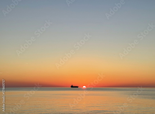 Bright sunset sky, sea and ferry, ocean landscape