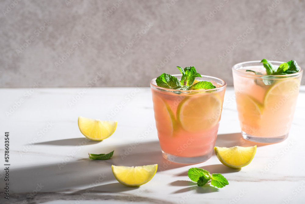 Fruity Moscow Mule cocktail on a marble background, long shadows. Variations of top cocktails. Refreshing summer drinks