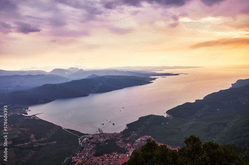 Aerial view of the sea and mountains at sunset in Montenegro