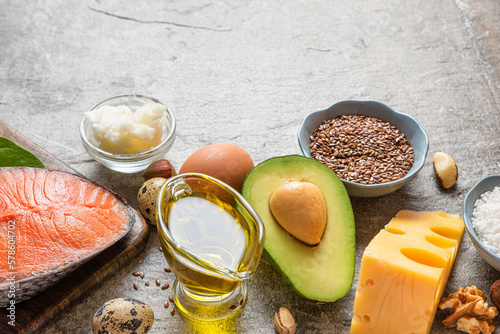 Low carb ketogenic diet with food rich with healthy fats and protein on concrete background. Healthy balanced food