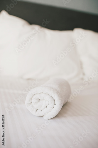 Bed and white linens in a hotel room.