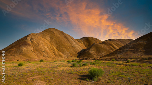 Beautiful landscape with yellow hills at sunset. Nature background.