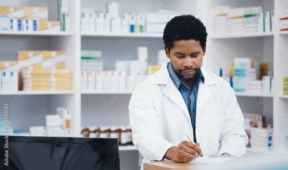 Pharmacist, stock or black man writing on clipboard for medicine check, retail research or medical prescription in drugstore. Notes, pharmacy or worker on paper documents in pills checklist or order