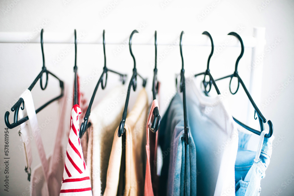 © Cavan Images - Close up of  clothing on a  rack.