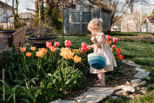 Child in garden on Easter egg hunt photo