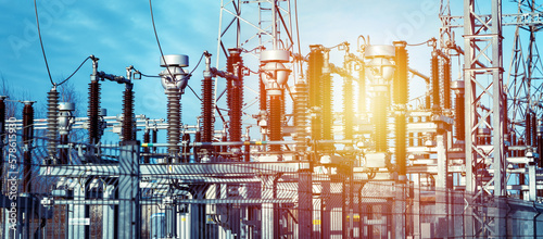 High voltage circuit breaker in a power substation.Electric power transmission lines in the evening. High voltage switchgear and equipment of power plant.Banner.