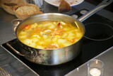 Meal preparation - shrimp soup cooking in a pot