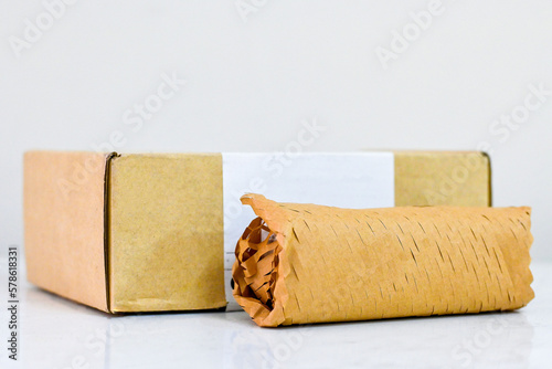 Eco friendly honeycomb wrapping paper packaging product shopping, packaging parcel carton box in net zero waste.Sustainable wrapping paper wrap reuse brown paper gift reduce plastic. Selective focus.
