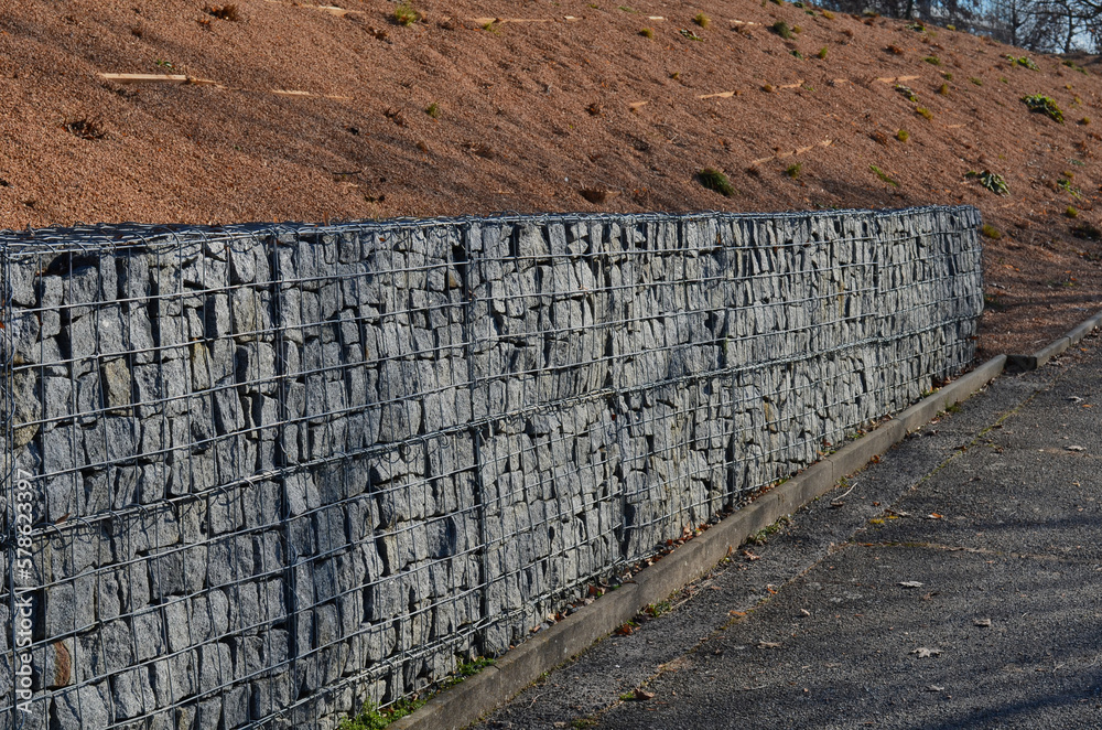 construction of a gabion retaining wall, as part of the house fencing