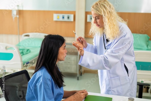 Young woman consult with doctor for botulinum toxin botox face injection at beauty treatment clinic