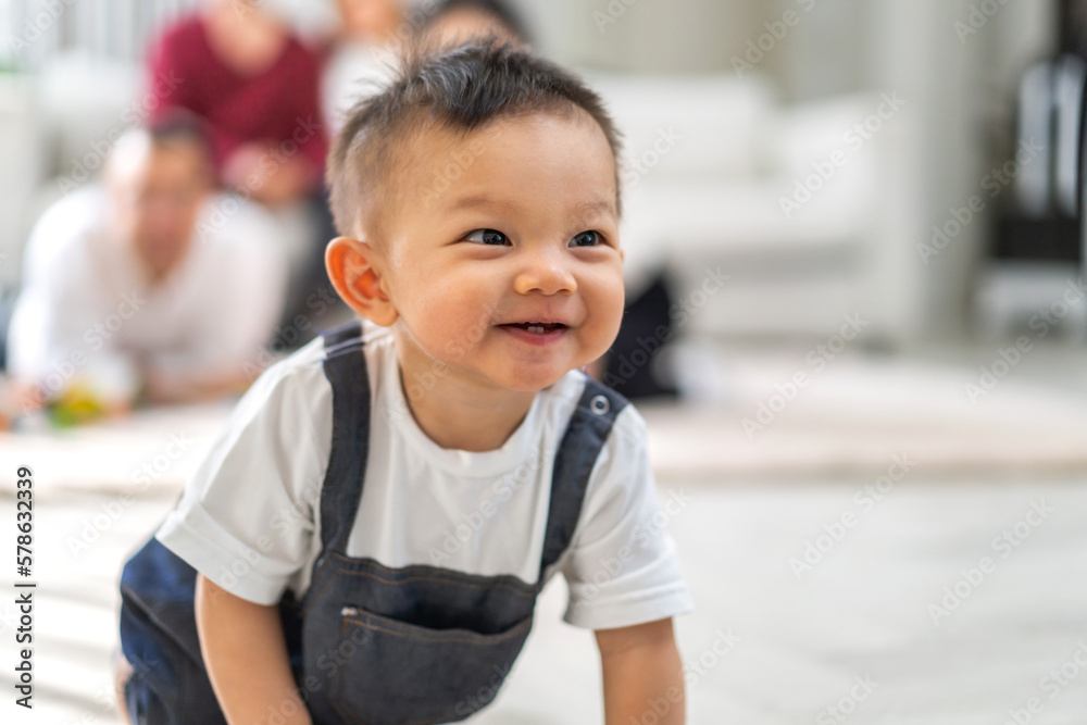 Portrait of happy smile asian baby boy relaxing looking at camera.Cute asian newborn child on the bed at home