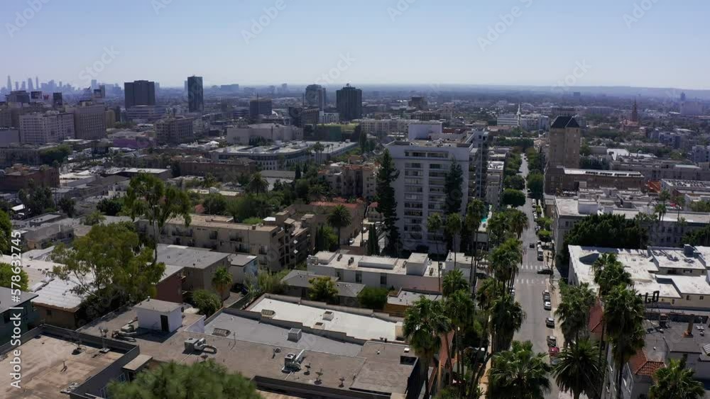 Low panning aerial shot across Downtown Hollywood with Downtown Los Angeles in the distance. 4K Low panning aerial shot across Downtown Hollywood with Downtown Los Angeles in the distance. 4K