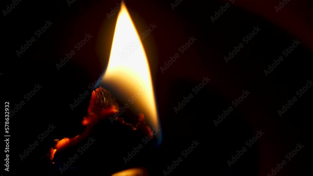 Flame on a candle with wood wick macro Flame on a candle with wood wick macro