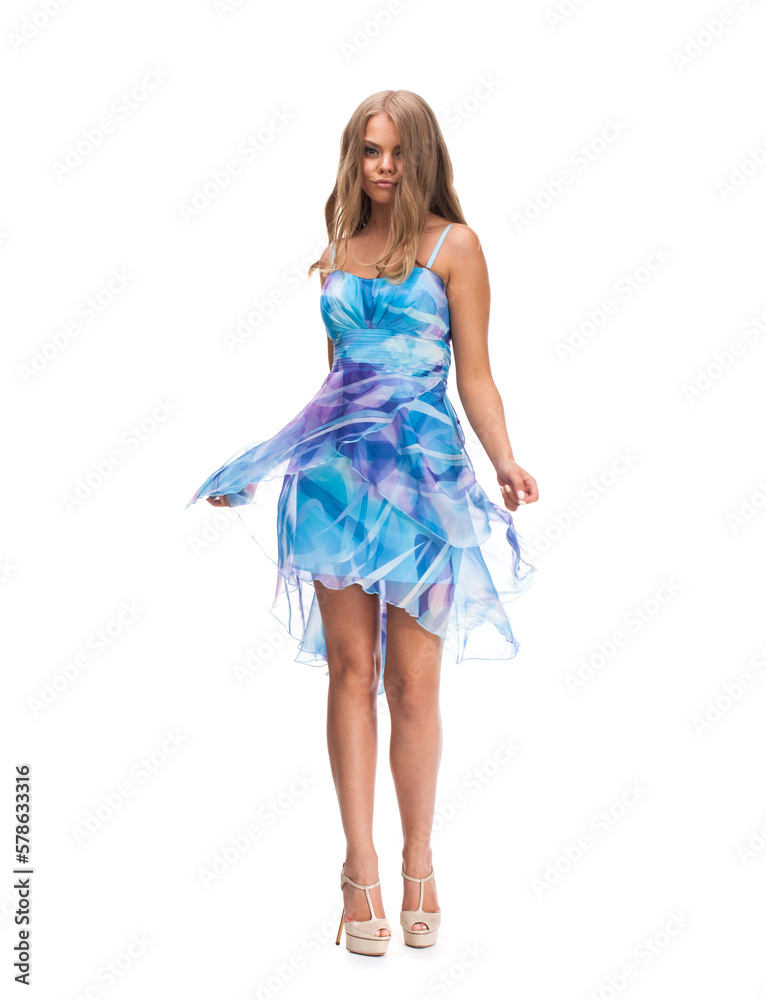 Young beautiful happy blonde woman in blue dress
