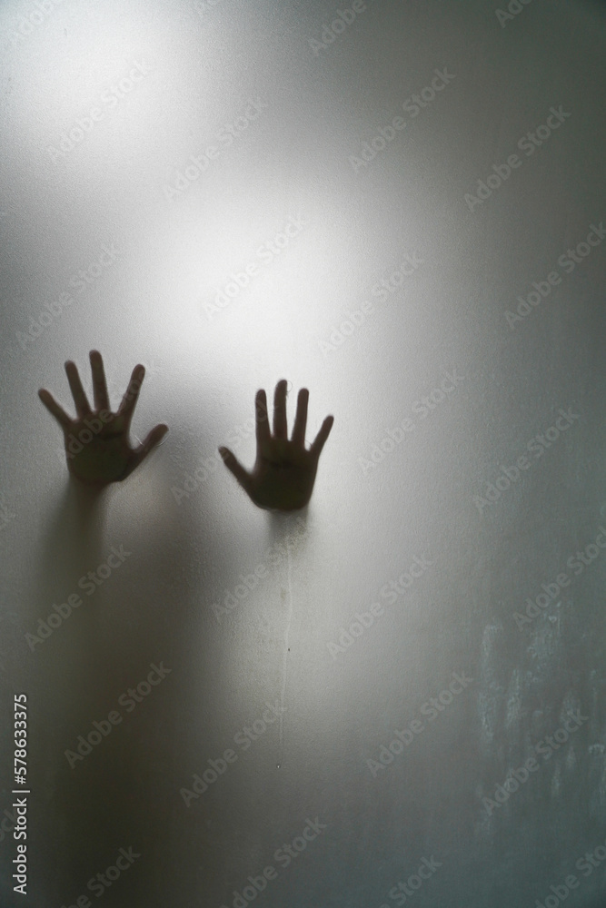 Left and right hand shadow blur behind frosted glass.shadow of hands behind frosted glass Left and right hand shadow blur behind frosted glass.shadow of hands behind frosted glass