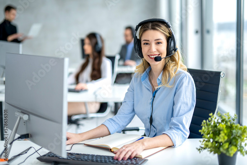 Portrait of female operator ready for online assistance at call center. photo