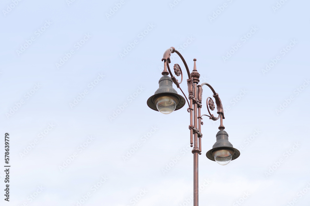 Beautiful old fashioned street lamps against sky Beautiful old fashioned street lamps against sky