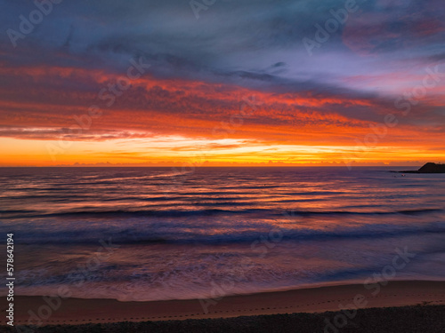Sensational high cloud sunrise at the seaside © Merrillie