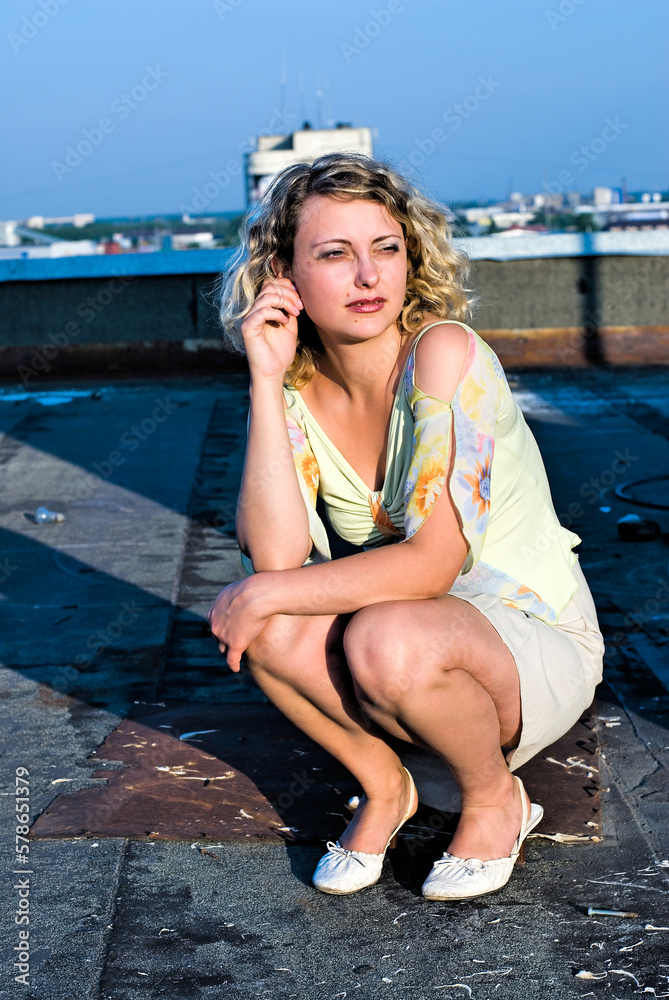 Young pretty woman on roof