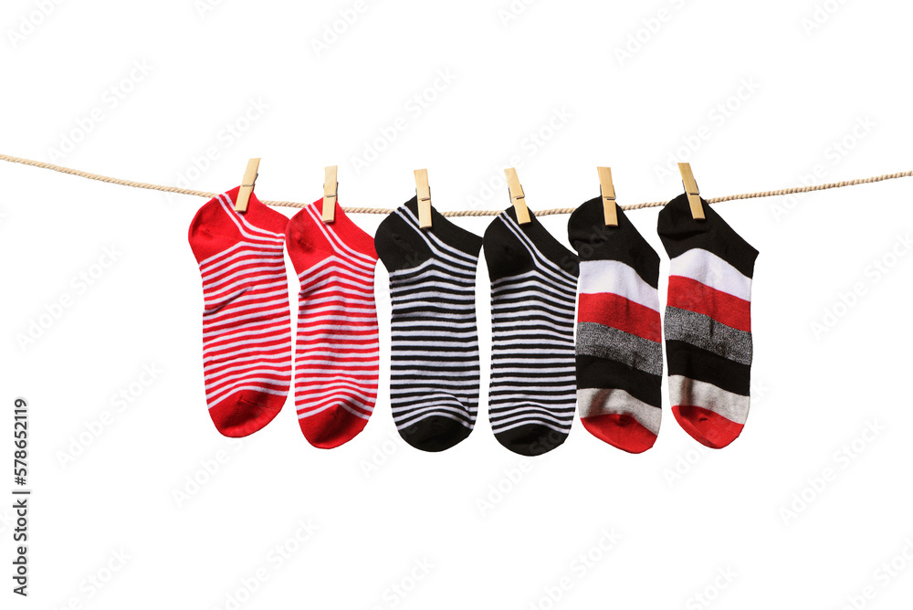 Clean washed striped socks hanging on rope isolated on white background. Clothesline with red, grey and white socks.